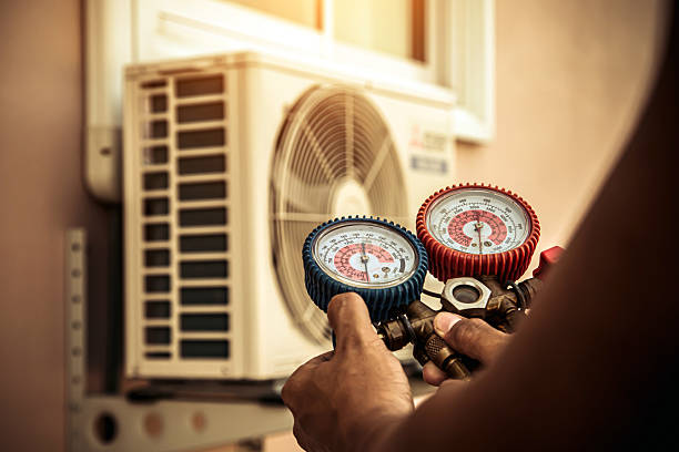 Professional Air Conditioning Service technician working in Sheridan, CO